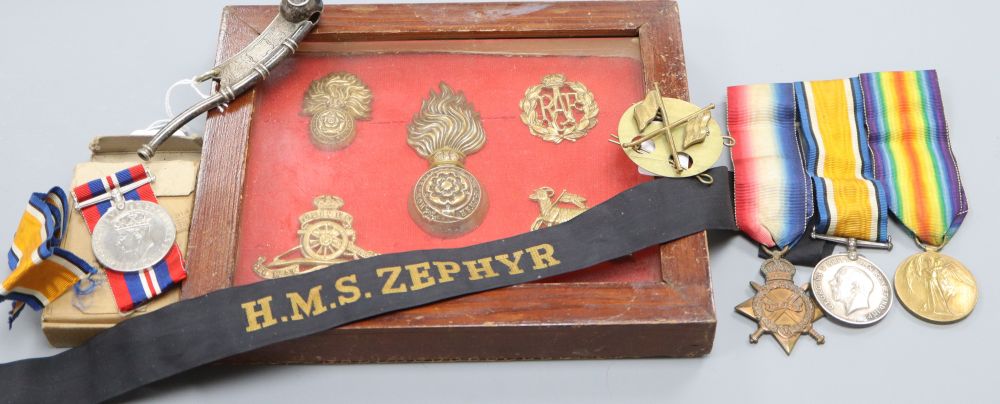 A Bosuns whistle, a 1st World War trio and 2nd World War Medals, badges etc